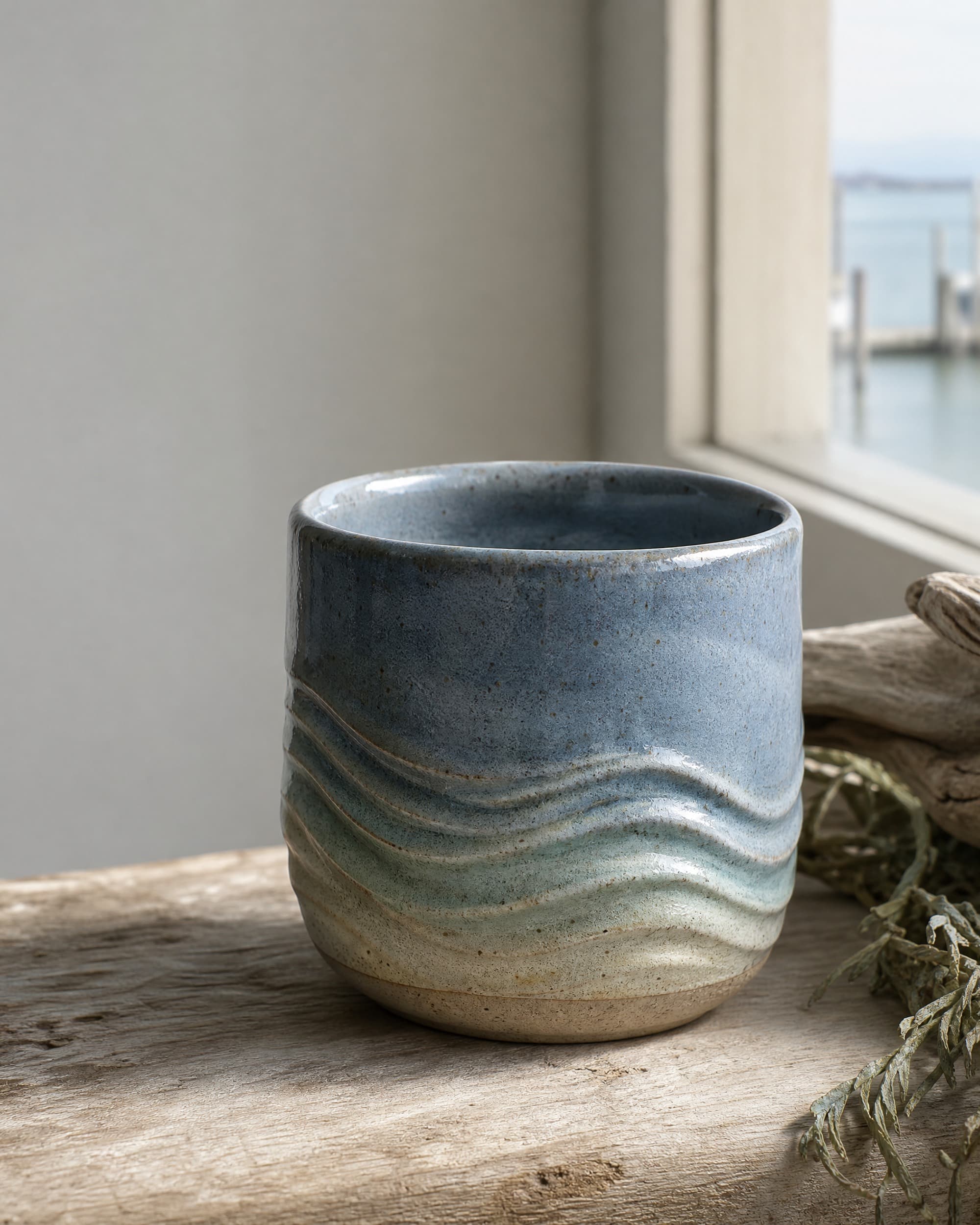 Example product artwork for the fictional Sample product Stoneware Tide Cup.